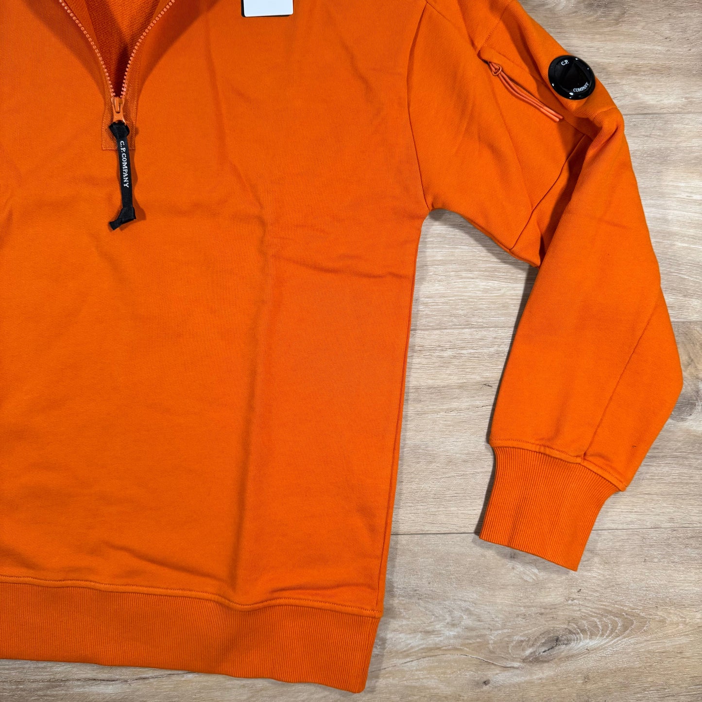 C.P. Company Diagonal Raised Half-Zip Lens Sweatshirt in Russet Orange
