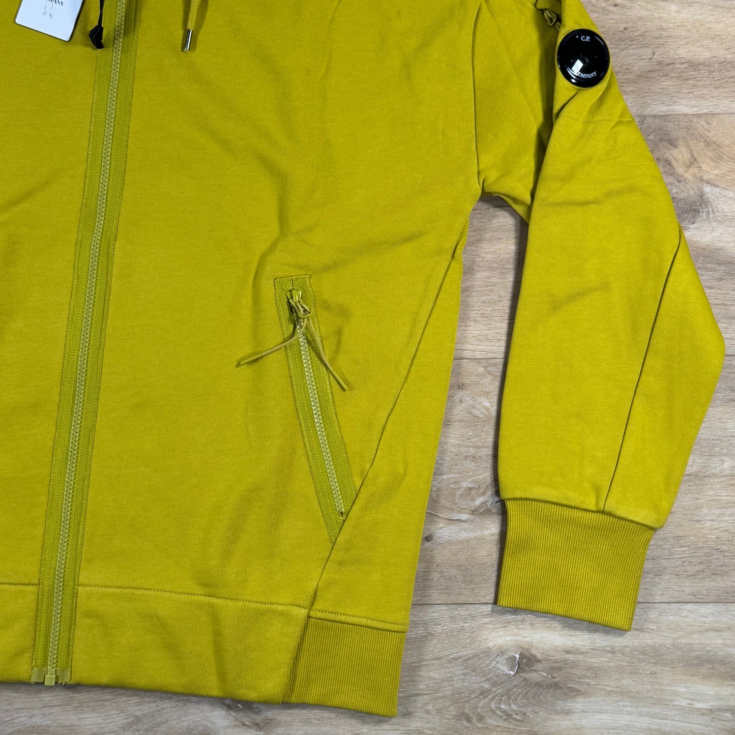 C.P. Company Diagonal Raised Zipped Lens Hoodie in Antique Moss - Yellow