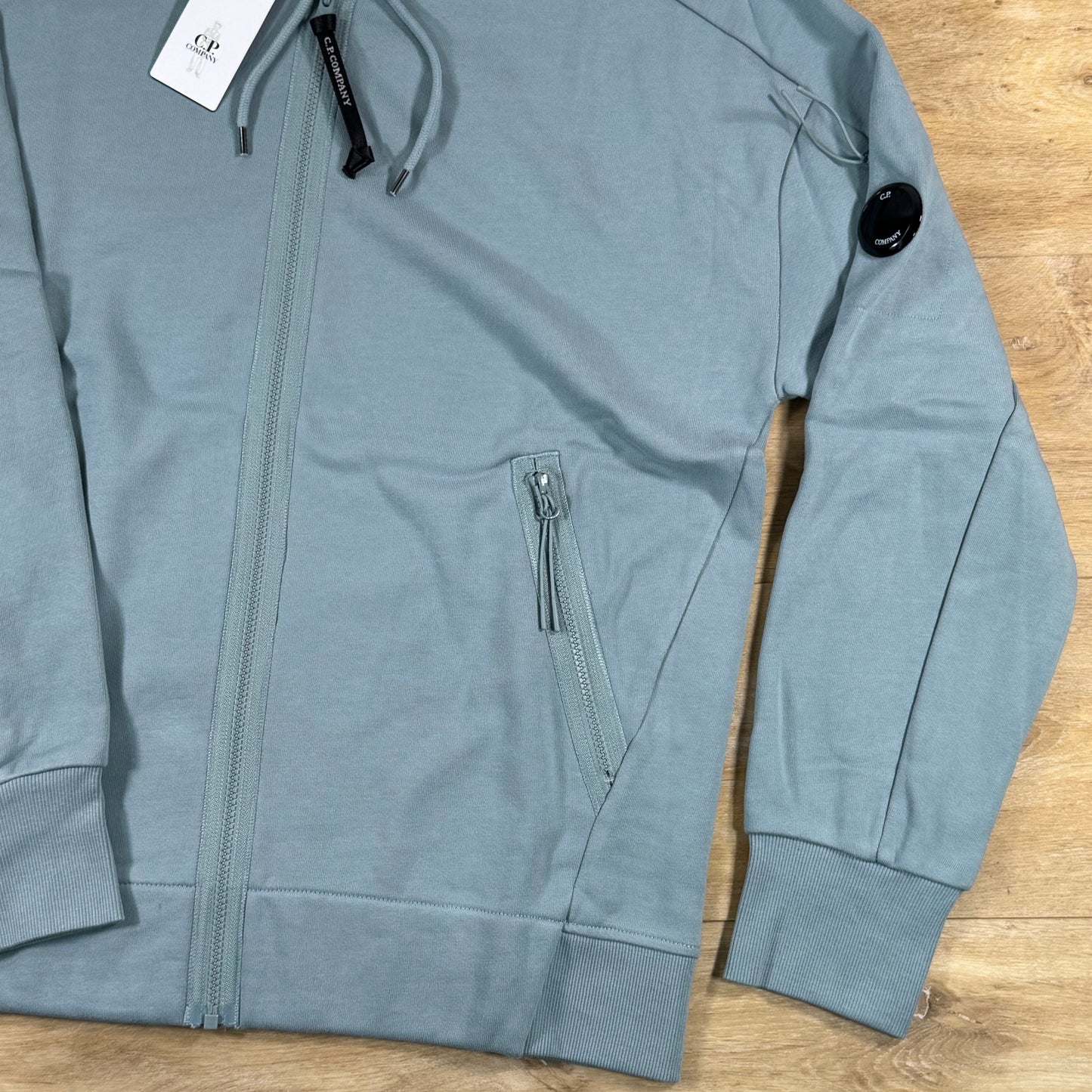 C.P. Company Diagonal Raised Zipped Lens Hoodie in Silver Blue