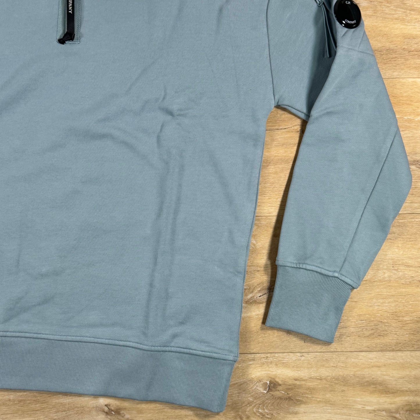 C.P. Company Diagonal Raised Half-Zip Lens Sweatshirt in Silver Blue