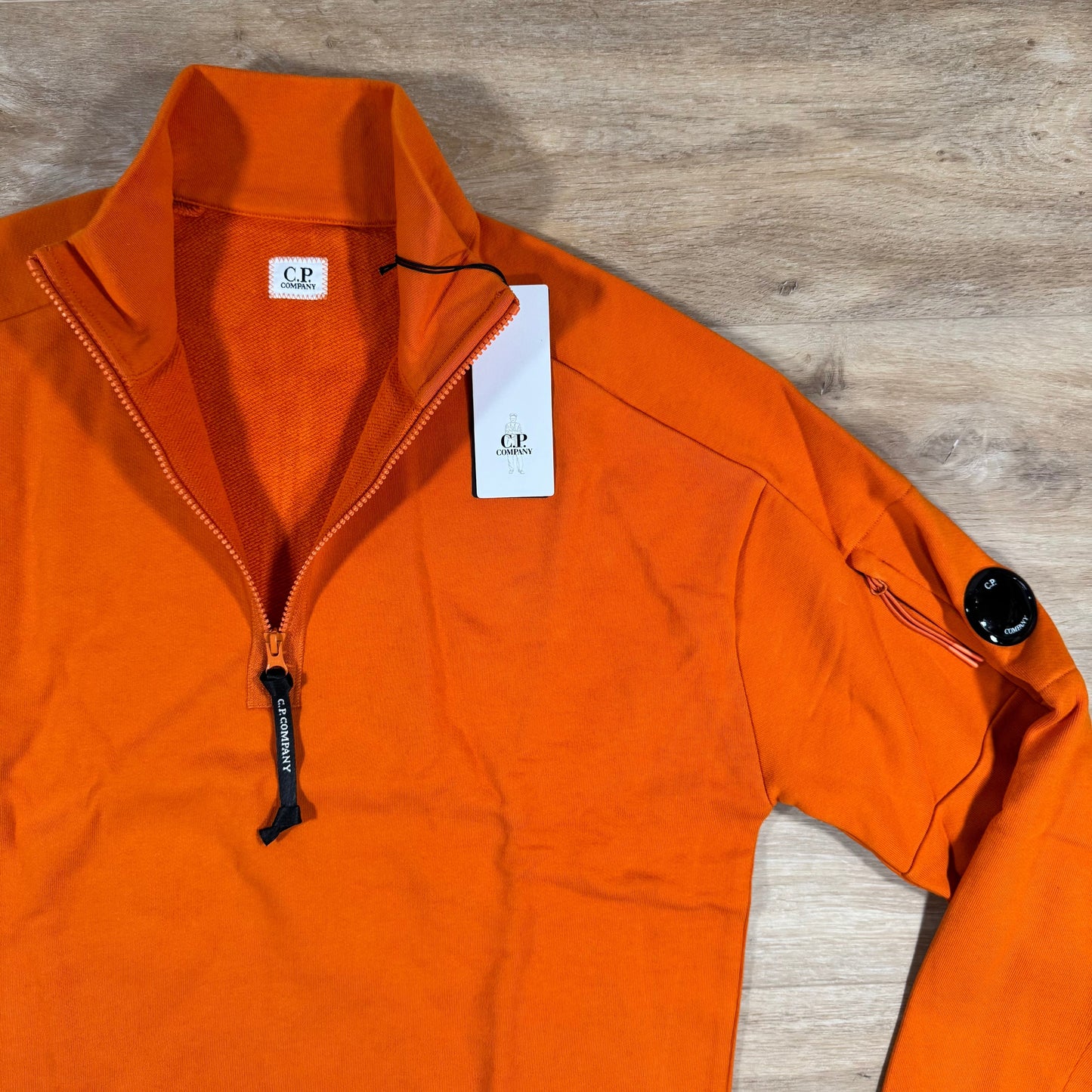 C.P. Company Diagonal Raised Half-Zip Lens Sweatshirt in Russet Orange