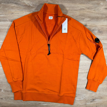 C.P. Company Diagonal Raised Half-Zip Lens Sweatshirt in Russet Orange
