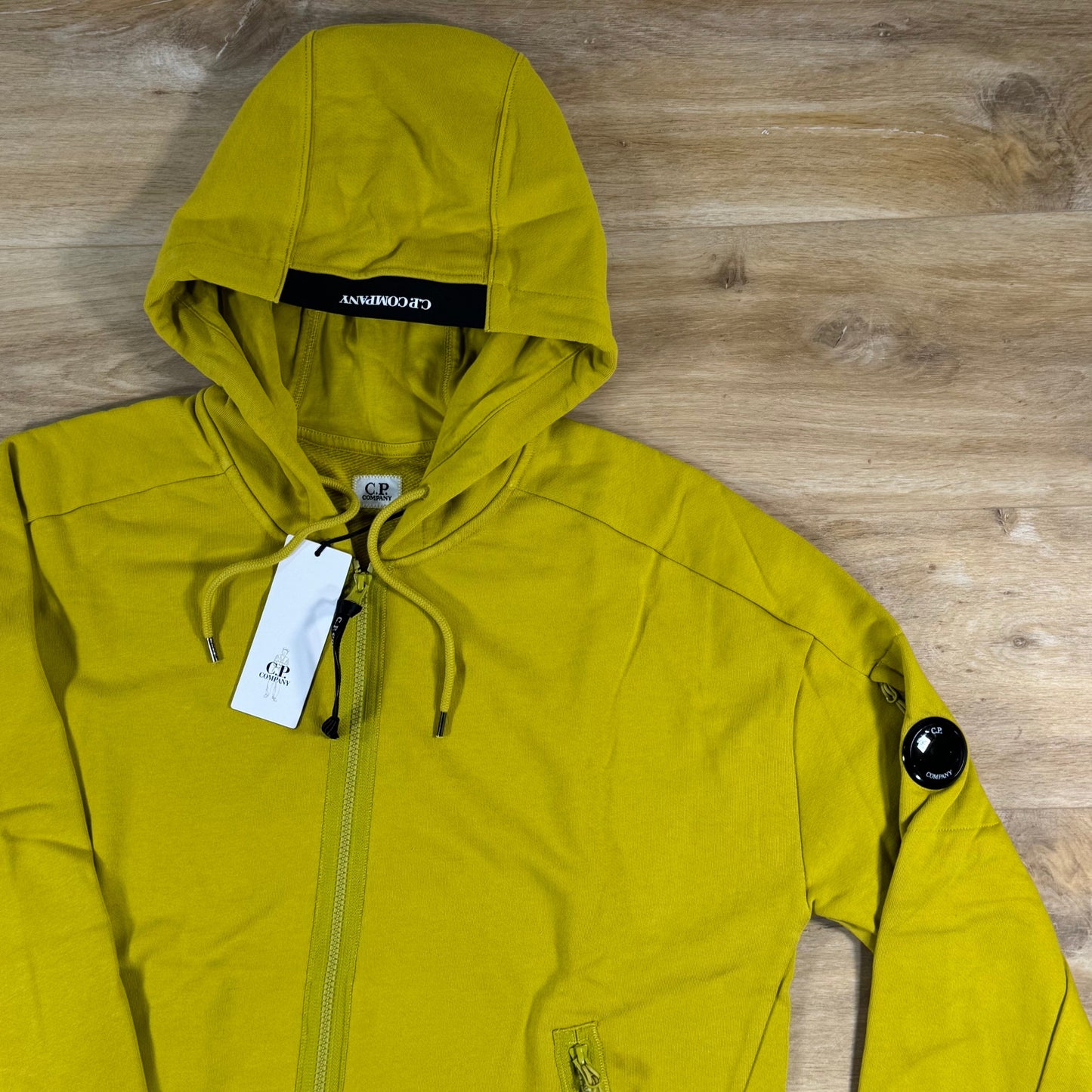 C.P. Company Diagonal Raised Zipped Lens Hoodie in Antique Moss - Yellow