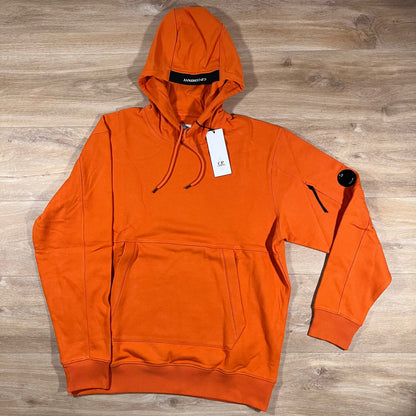 C.P. Company Diagonal Raised Fleece Lens Hoodie in Russet Orange
