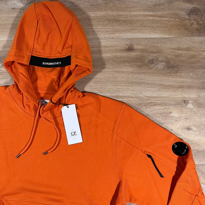 C.P. Company Diagonal Raised Fleece Lens Hoodie in Russet Orange